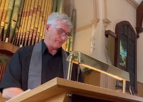 Jeff Sager leading a church service